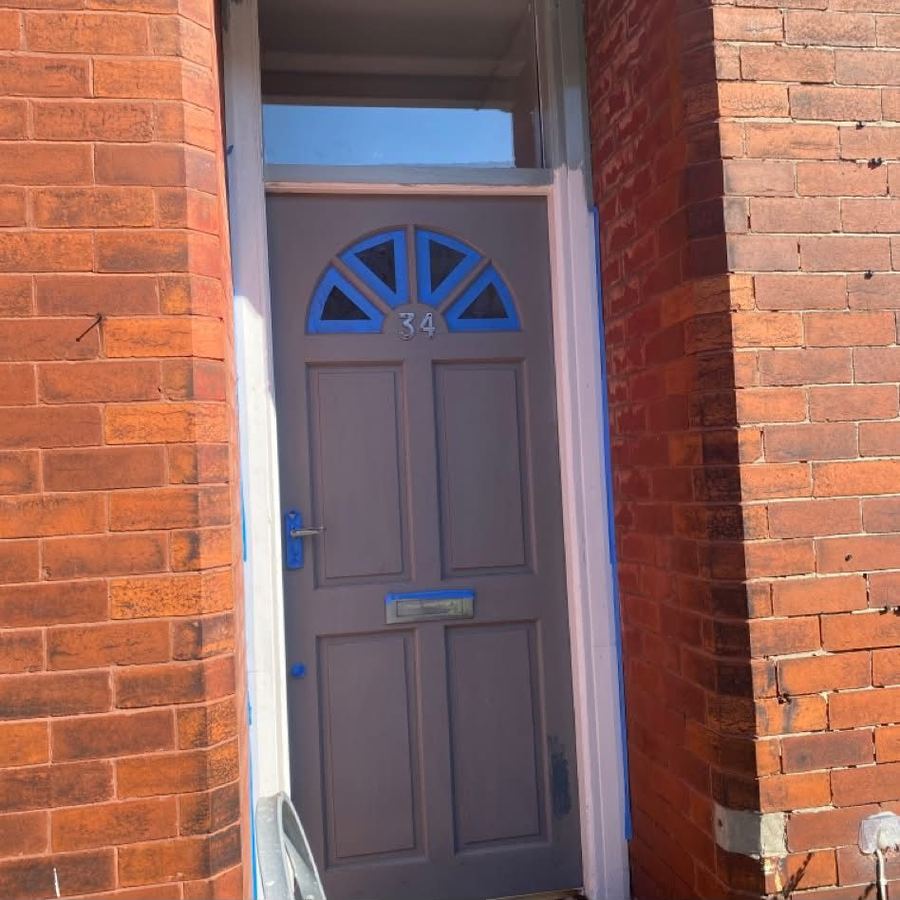 Front door masked up in primer before repaint