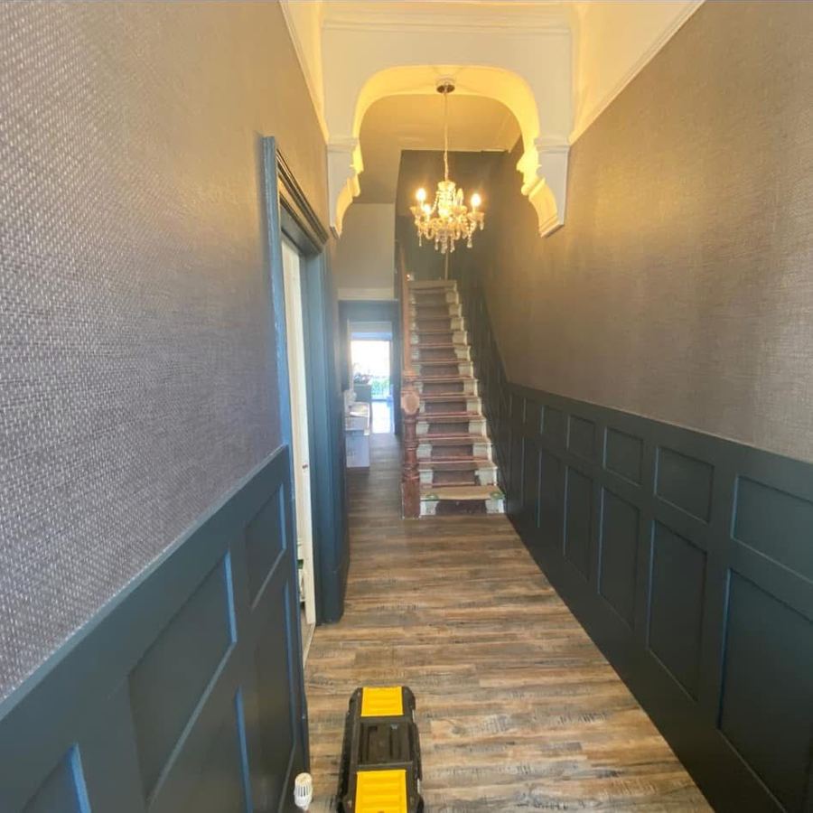 Victorian hallway with new panelling, chandelier and wood flooring