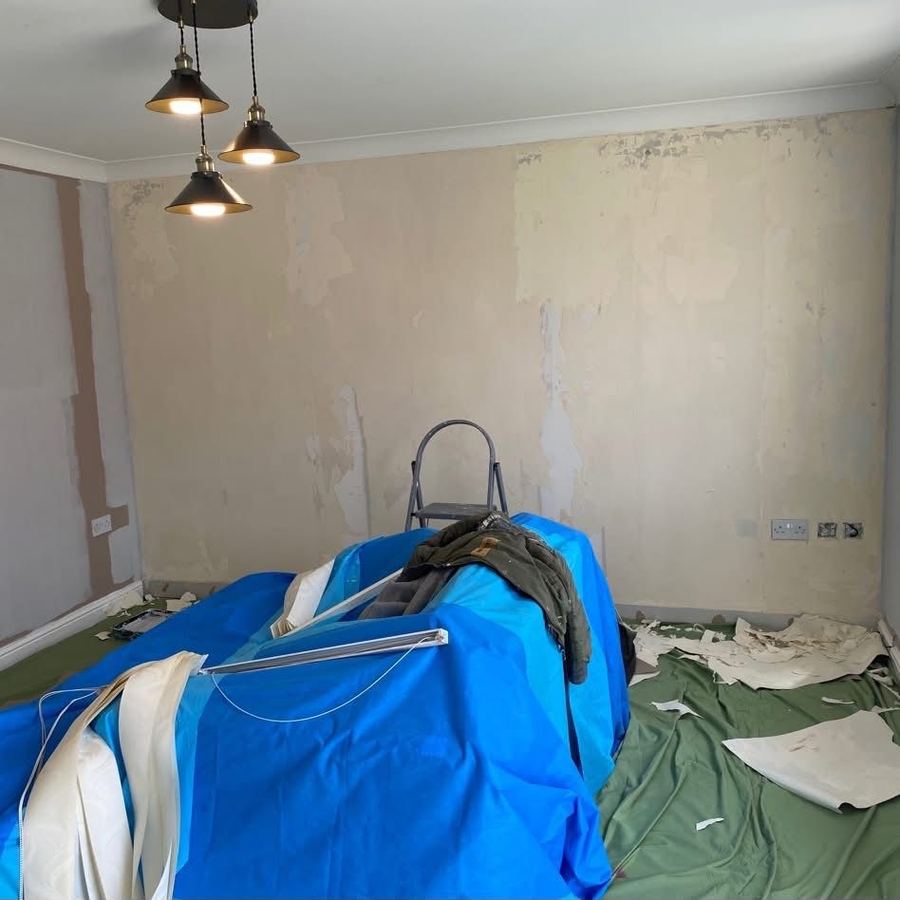 Bedroom with stripped walls before replastering and painting