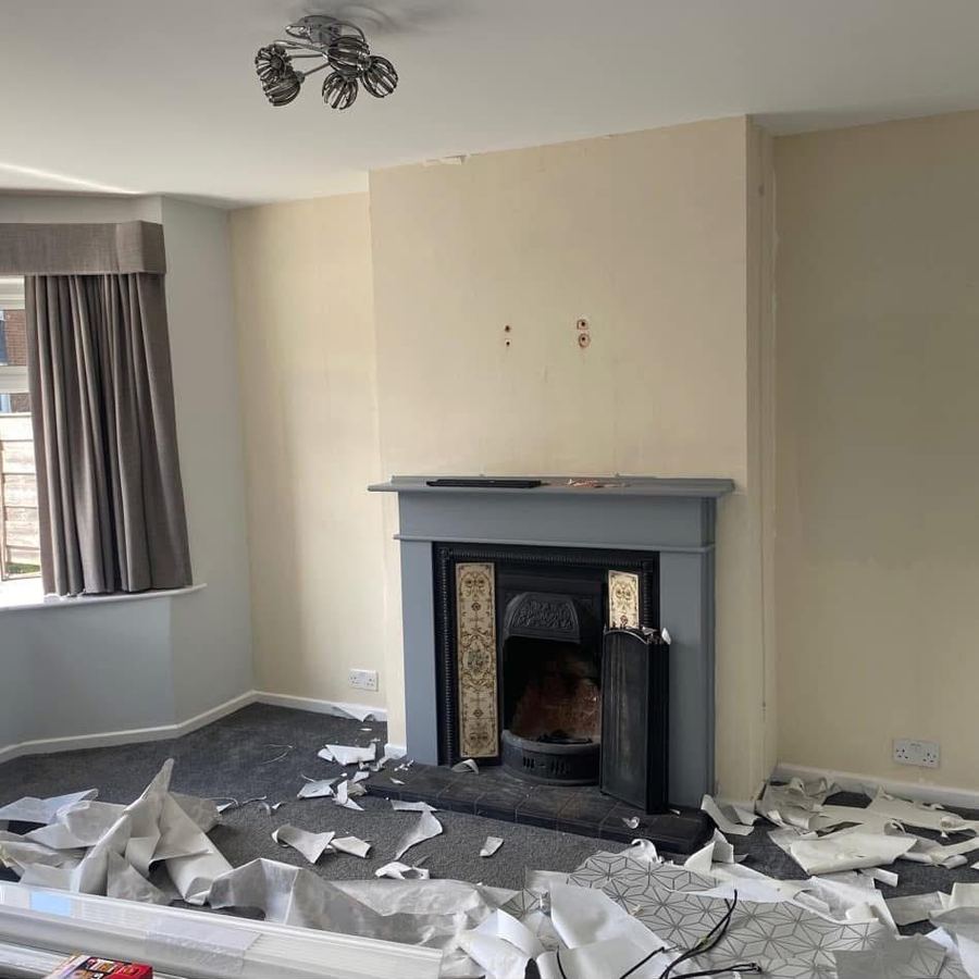 Living room mid-wallpaper-strip before redecoration