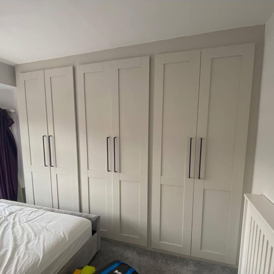 Fitted wardrobes resprayed white with new black handles