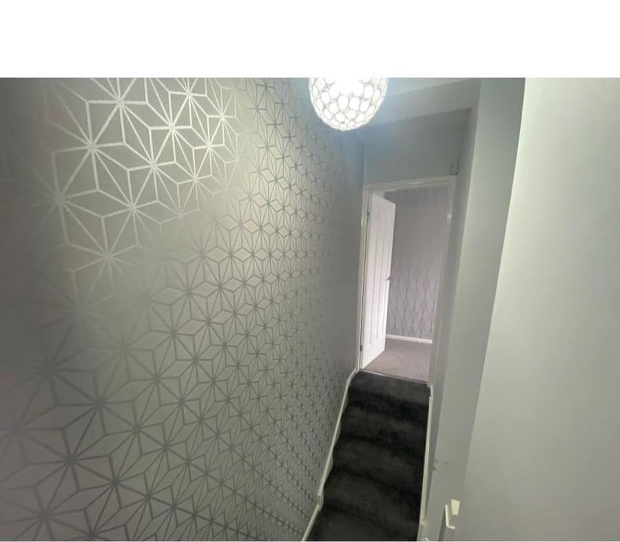 Stairwell with geometric feature wallpaper before update