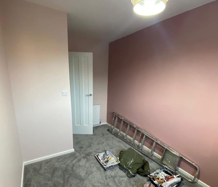 Bedroom repainted with blush pink feature wall