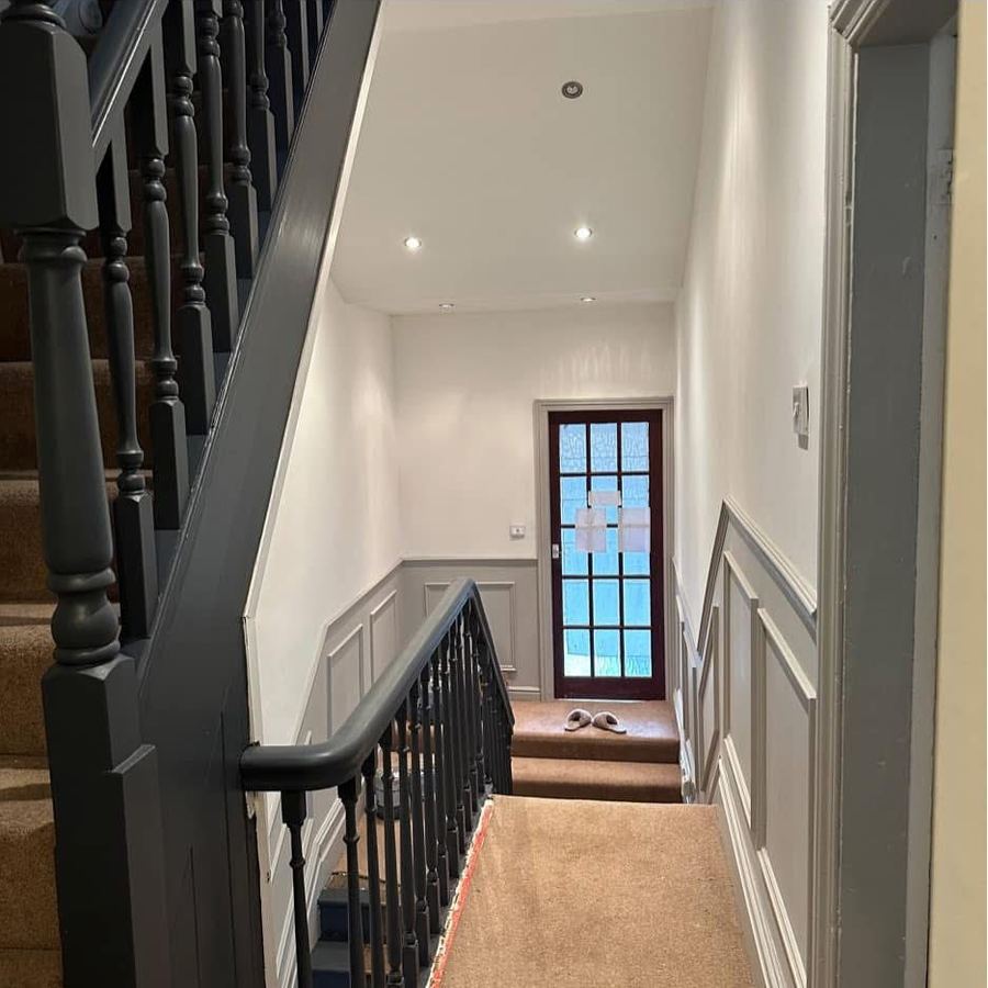 Landing and stairs freshly decorated with grey woodwork
