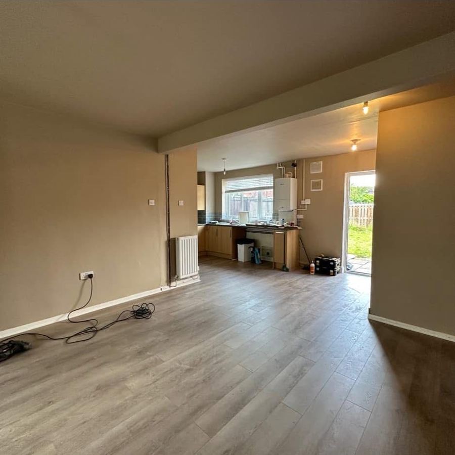 Open-plan kitchen and living space after wall removal and full refurbishment